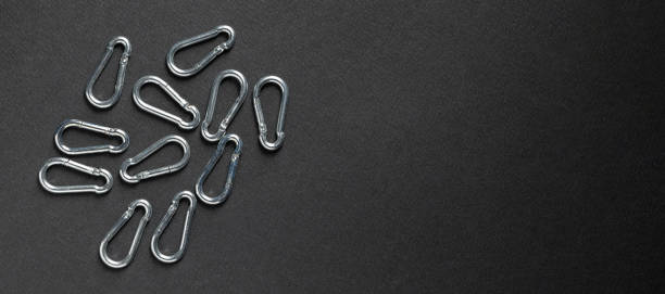 istock 4mm climbing carabiner isolated against a dark background 1405981195