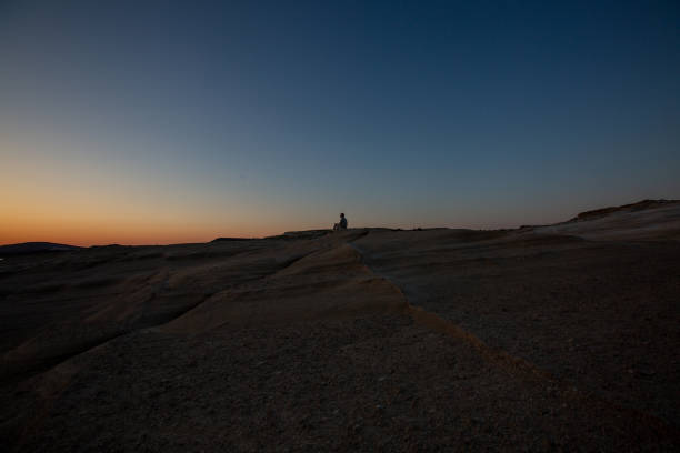 istock One man standing top hill sunrise 1405981904