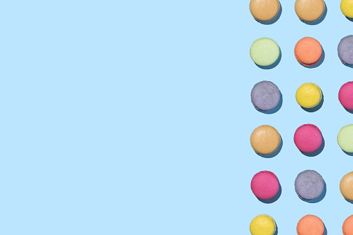 Pastel background with colorful macaroons