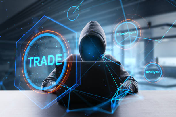 istock Hacker at desktop using laptop with creative polygonal trade hologram on blurry office interior background. Technology, hacking, phishing, financial data and fintech concept. Double exposure. 1405982269