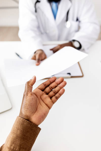 istock Giving patient a prescription for medication 1405986074
