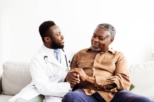 istock Health visitor and a senior man during home visit 1405986184