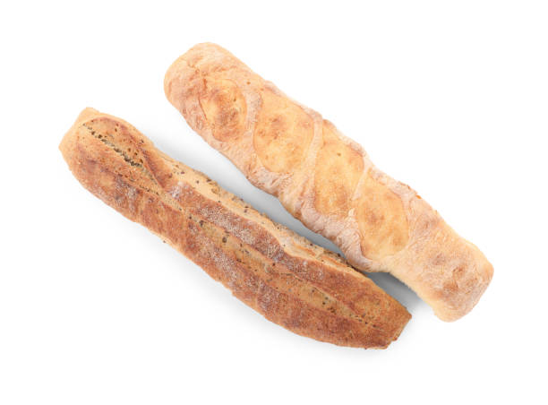 istock Different tasty baguettes on white background, top view. Fresh bread 1405986228