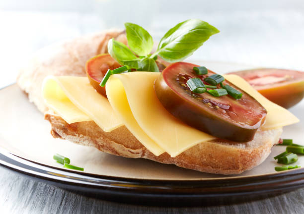 istock Sandwich with cheese and tomatoes. Close up. 1405987786