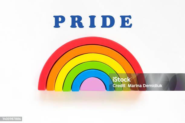 Wooden Rainbow And Pride Lettering On A White Background The Rainbow Toy Puzzle Lgbt Flag Gay Pride Community Equal Rights Movement And Gender Equality Life Concept Flat Lay Top View Copy Space Stock Photo - Download Image Now