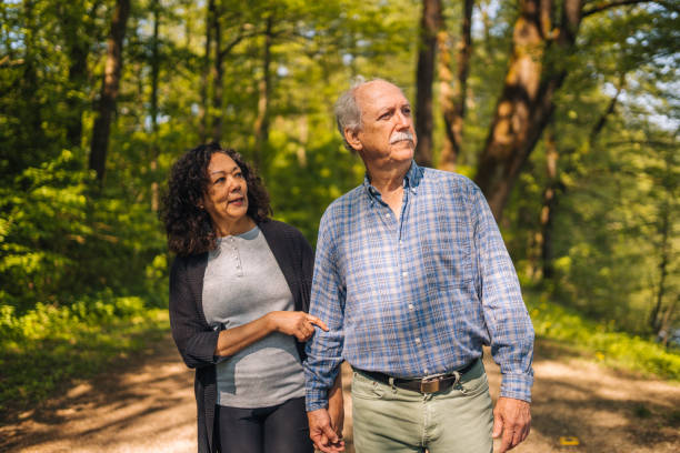 istock Retired Couple Taking a Walk in the Woods 1405988263