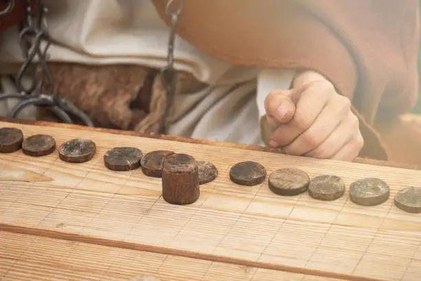 Photo of Ludus Latrunculorum, or Latrunculi, is an ancient Roman strategy game. Reconstruction of board games from the Roman Empire