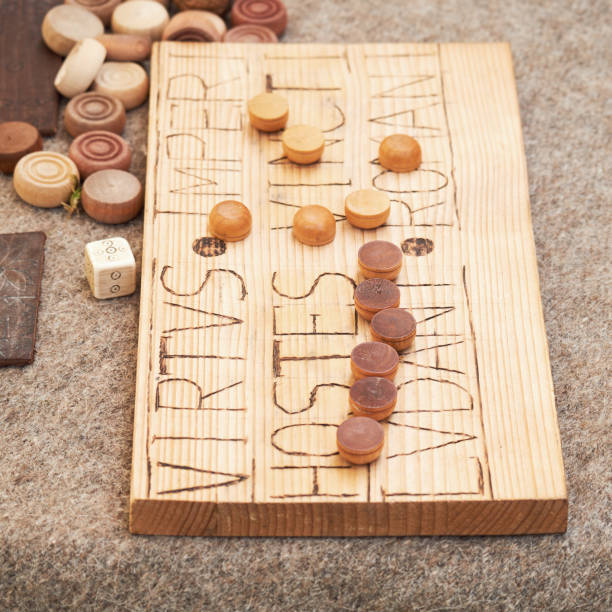 istock Ludus duodecim scriptorum, is an ancient Roman game Translated from Latin - Valor of the enemy Empire has shackled, the Romans are playing 1405988403