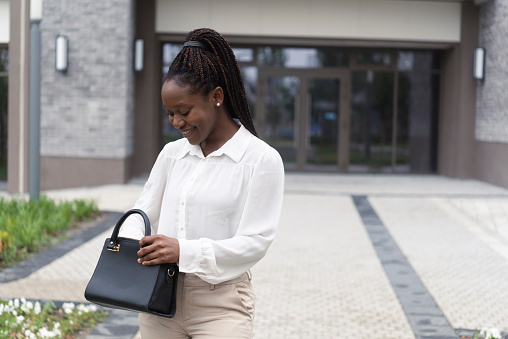 Portrait of a beautiful African American businesswoman coming back from work