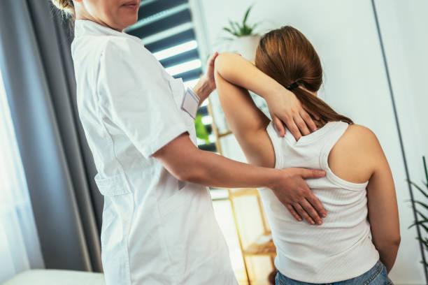 istock Teen Girl having chiropractic back adjustment. 1405991045