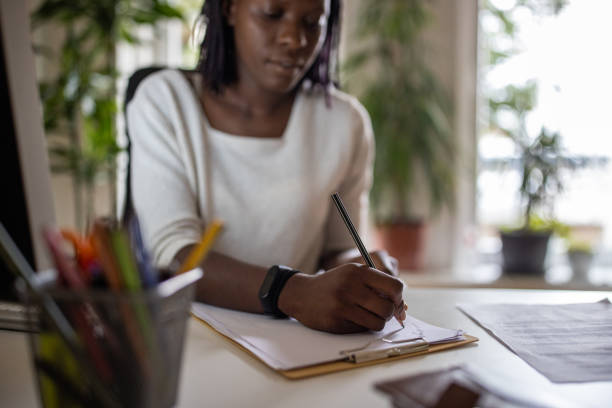 istock Woman Black ethnicity working at the modern office 1405993407