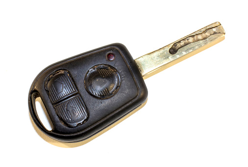 Old car key isolated on white.
