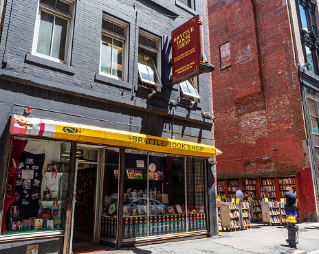 Boston, Massachusetts, USA - June 28, 2022: The Brattle Book Store (est 1825) on West Street in downtown Boston. It offers general used books, rare and antiquarian books. Beside the store building is their vacant lot full of books for sale. The owner appraises books and libraries throughout the country and has appeared on the Antiques Roadshow TV show.
