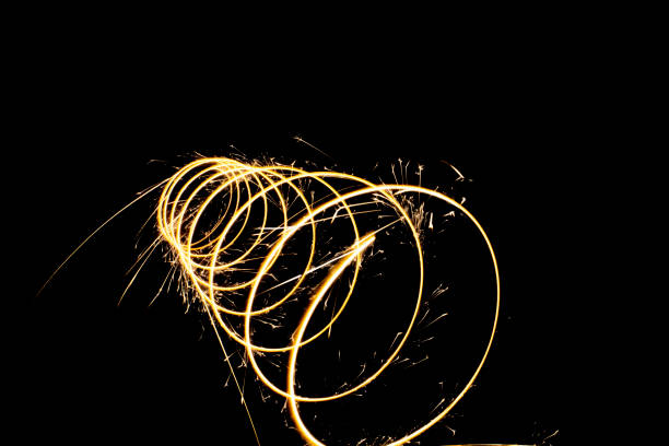 istock Circular lights with sparks on a black background 1405995001
