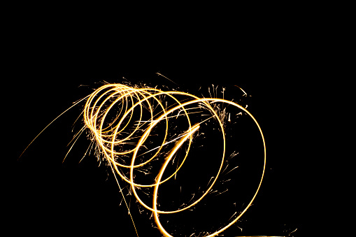 Circular lights with sparks on a black background