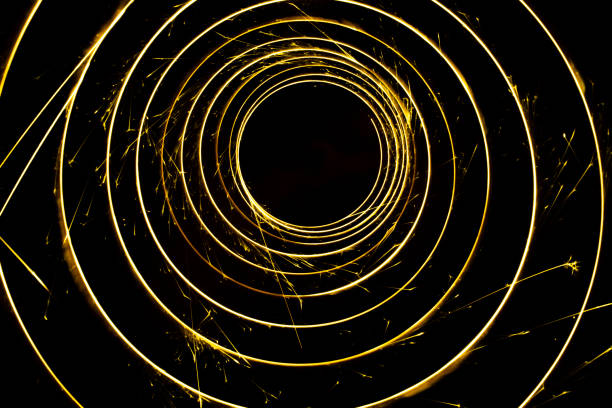 istock Circular lights with sparks on a black background 1405995024