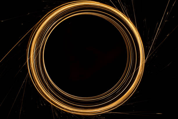 istock Circular lights with sparks on a black background 1405995208