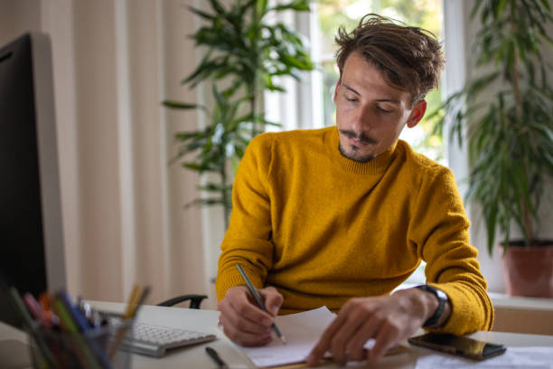 istock Caucasian man working at the modern office 1405995408