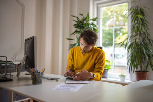istock Caucasian man working at the modern office 1405995460