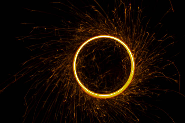 istock Circular lights with sparks on a black background 1405995962