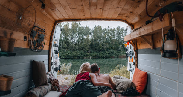 istock Couple enjoying the view from their van 1405996557
