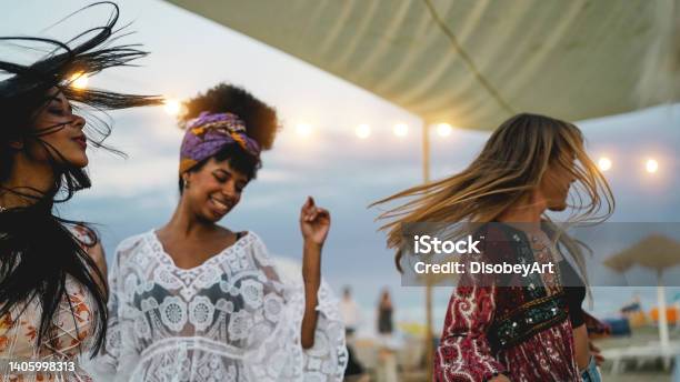 Multiracial Friends Having Fun Dancing Together Outdoor At Beach Party Soft Focus On Left Girl Face Stock Photo - Download Image Now