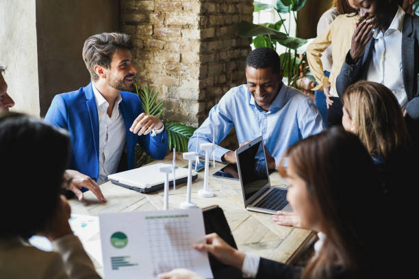 istock Multiracial business people working on sustainable innovation project - Focus on left man face 1405999302
