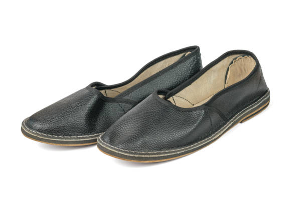 istock A pair of leather slippers isolated on a white background. 1405999615