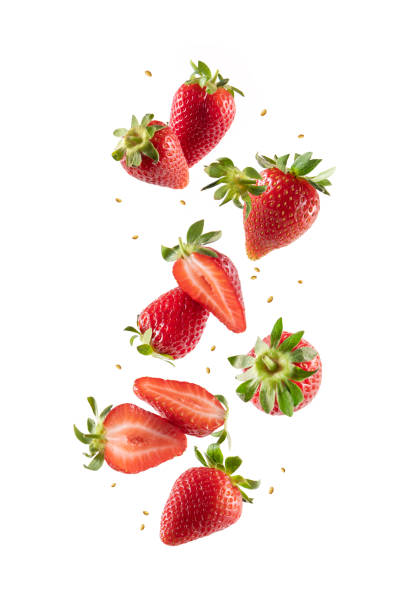 istock Whole and Sliced Fresh Strawberries in Air on White Background 1406005789
