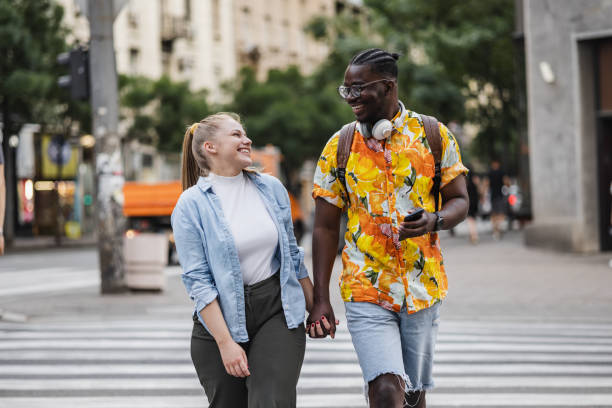 Heterosexual couple walking down the street