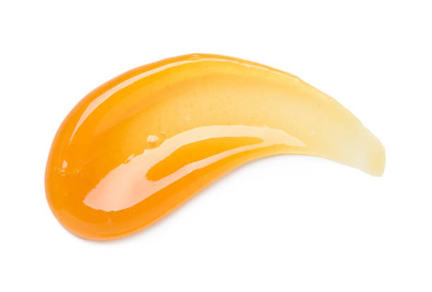 istock Clear orange gel smear curve with bubbles isolated 1406008510