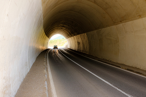 car passes tunnel