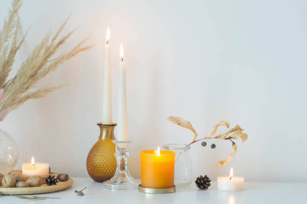 istock autumn home decorations with burning candles 1406014786