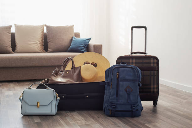 istock suitcases packed for travel on  living room floor 1406014837