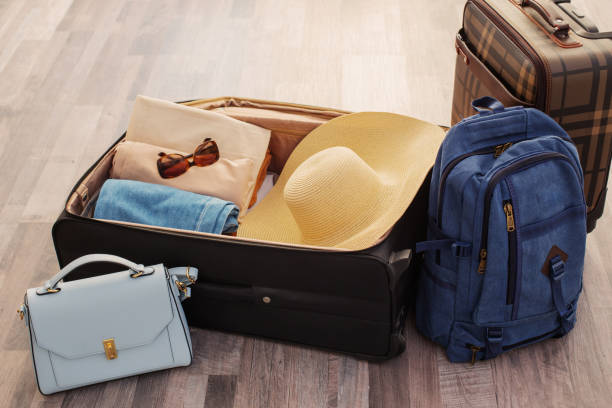 istock suitcases packed for travel on  living room floor 1406014917