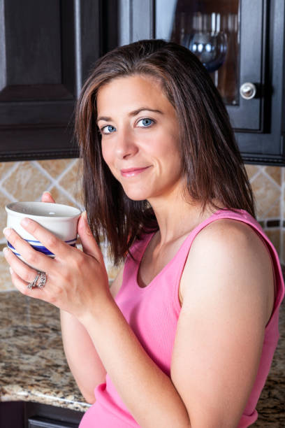 istock Attractive woman with a cup of coffee 1406016416