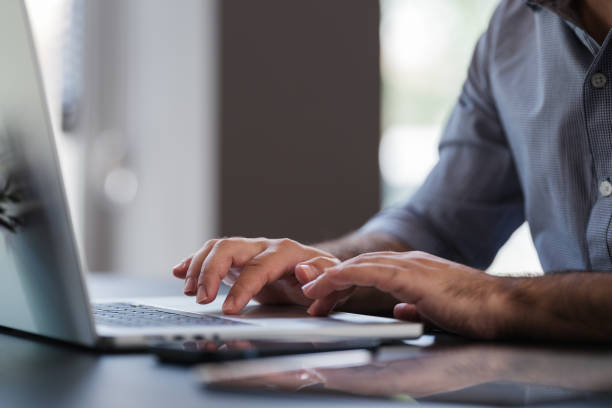 istock Portrait Of Man Working In The Office Or At Home Using Smartphone, Digital Tablet And Computer 1406016767
