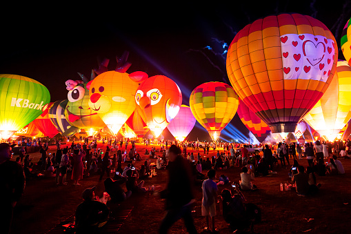 Chiang Rai, Thailand: 15 - February 2020: Night atmosphere of the 5th International Balloon Festival in Chiang Rai Province, Thailand.