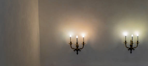 istock Vintage wall lamp. Space for text. Lamp light on the wall. Working lamps at dusk. 1406020019