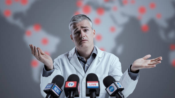 istock Funny medical scientist interviewed by the media 1406020540