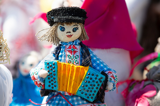 Ethnic toy of a musician with an accordion.