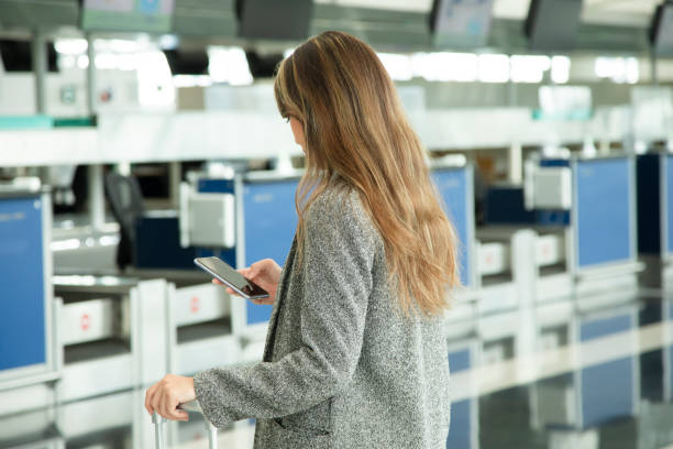istock A young lady is waiting for check in at the counter 1406021093