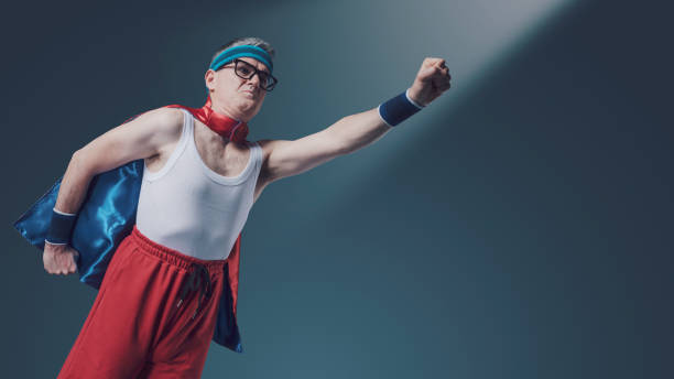 istock Funny flying superhero with clenched fist 1406021214