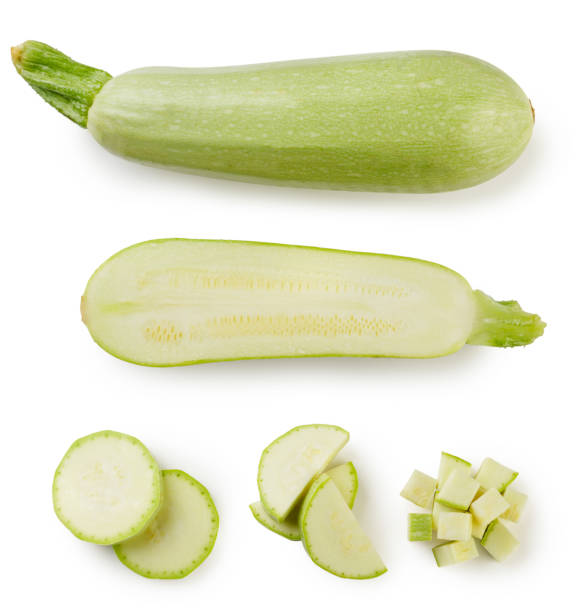 istock Zucchini, half and slices close-up on a white background. Top view. 1406021360