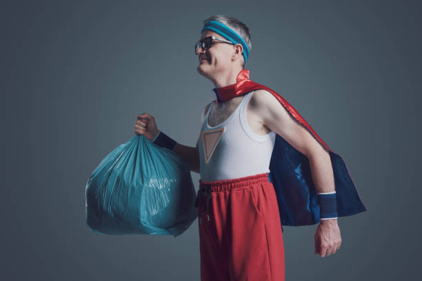 istock Ecology superhero holding a trash bag 1406021894