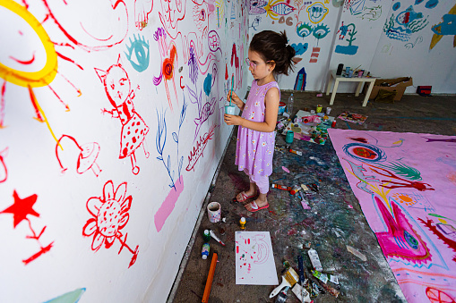 Little girl spends her creative days at home