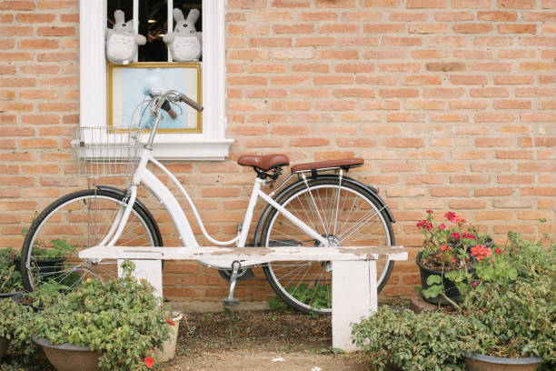 istock white bicycle beside the restaurant, unique decoration in a restaurant wall. 1406022170