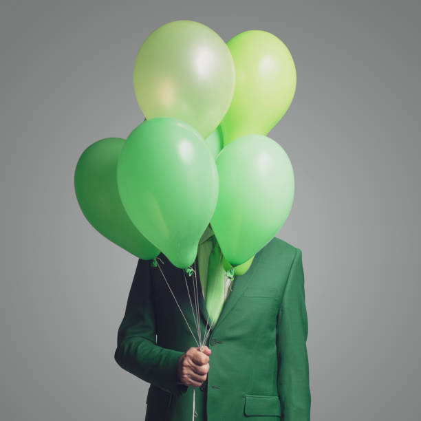 istock Businessman hiding behind balloons 1406022300