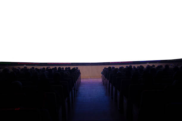 istock People in the cinema in front of an empty white screen. 1406022308