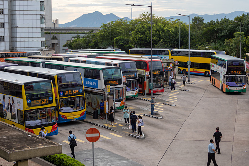 Hong Kong - June 29, 2022 : People at the Central (Macau Ferry) Bus Terminus in Sheung Wan, Hong Kong.